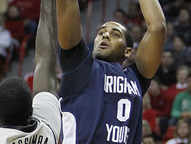 BYU's Brandon Davies shoots over UNLV's Brice Massamba during a game on Jan. 5, 2011, in Las Vegas. (AP Photo/Isaac Brekken)