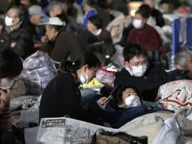 Survivors shelter at an evacuation center at Watari, Japan