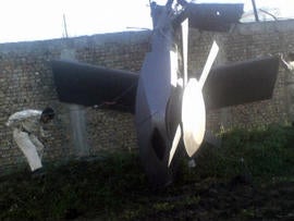 A photo of the damaged U.S. helicopter seen lying near the compound where Osama bin laden was killed and captured.