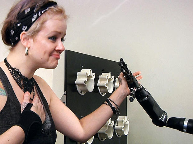 Robotic arm lets paralyzed man touch girlfriend