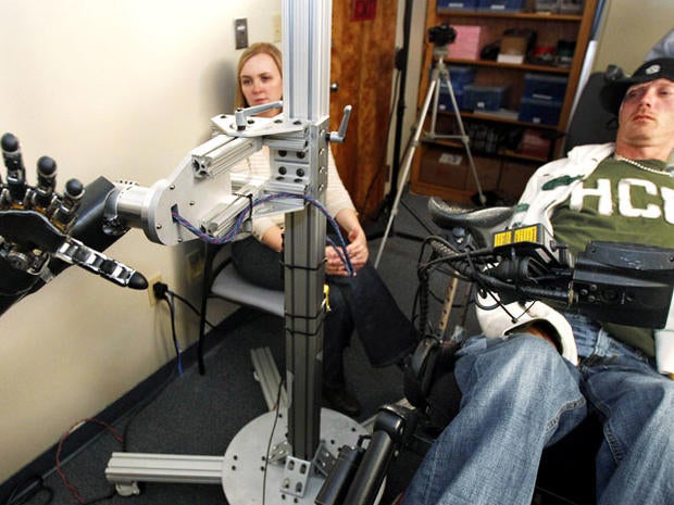 Robotic arm lets paralyzed man touch girlfriend