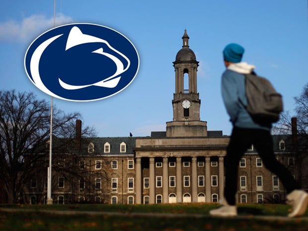 A students walks in front of the Old Main building on the Penn State campus Friday, Nov. 11, 2011, in State College, Pa. The Penn State University board of trustees who fired legendary football coach Joe Paterno and school president Graham Spanier are meeting Friday in the wake of the massive shakeup prompted by a child sex-abuse scandal.