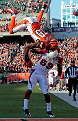 Jerome Simpson flips over Daryl Washington