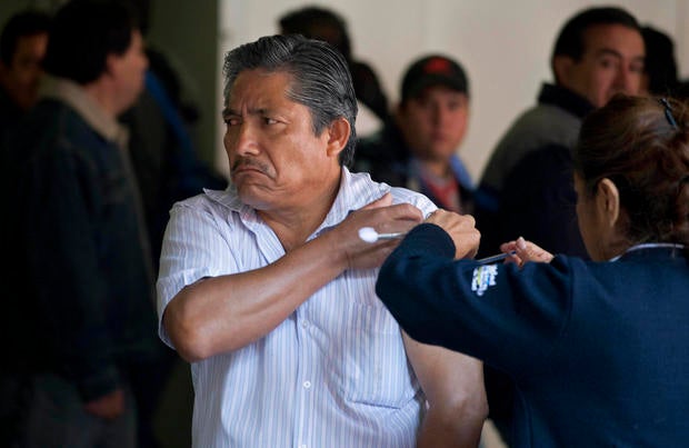 A man gets a voluntary swine flu vaccination from a nurse at a subway station in Mexico City, Tuesday Jan. 31, 2012. Federal Health Secretary Salomon Chertorivski Woldenberg said Tuesday there have been 1,623 cases of all strains of flu in Mexico so far in January, 90 percent of them H1N1. Despite the spike, Chertorivski said the cases are within normal range for a flu season.