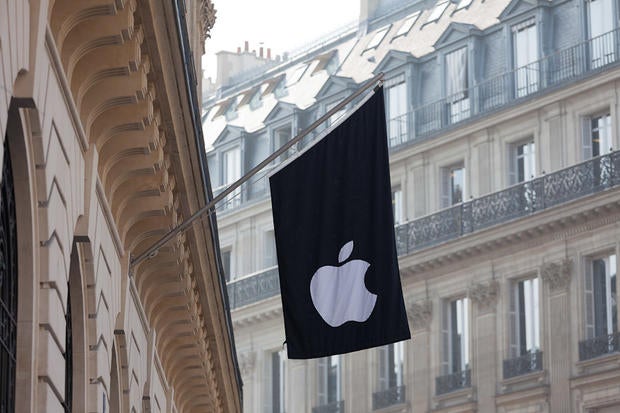 The Apple store in Paris sports the company logo on a flag.