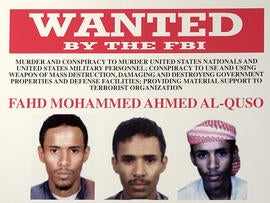 A wanted poster for Fahd Mohammed Ahmed al-Quso issued by the FBI is seen at FBI headquarters May 15, 2003, in Washington.