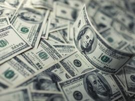 Hundred dollar bills money pile.