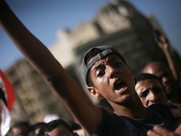 An Egyptian protester chats anti-Supreme Council for the Armed Forces (SCAF) slogans in Tahrir Square, Cairo, Egypt, June 21, 2012.