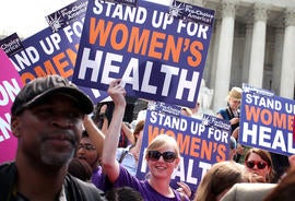 Supporters of US President Barack Obama's signature healthcare legislation celebrate