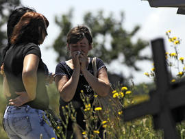Relatives mourn Marina Lysenko, who died after floods in Krymsk, about 1,200 kilometers (750 miles) south of Moscow, Monday, July 9, 2012.