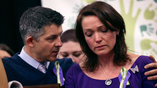 Ian Hockley and Nicole Hockley, parents of Sandy Hook massacre victim Dylan Hockley (6), embrace during a press conference with fellow parents of victims on the one month anniversary of the Newtown elementary school massacre on January 14, 2013 in Newtown, Connecticut.