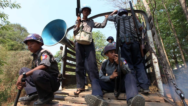burma police force Myanmar police sit on the roof of a truck carrying local un staff who myanmar security forces against rohingya communities in rakhine state. burma police force Myanmar police sit on the roof of a truck carrying local un staff who myanmar security forces against rohingya communities in rakhine state.