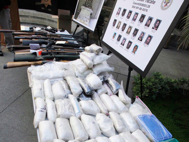 Weapons and drugs seized from the La Familia drug cartel are shown in San Bernadino, CA