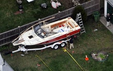 Boston bombing suspect found hiding in boat