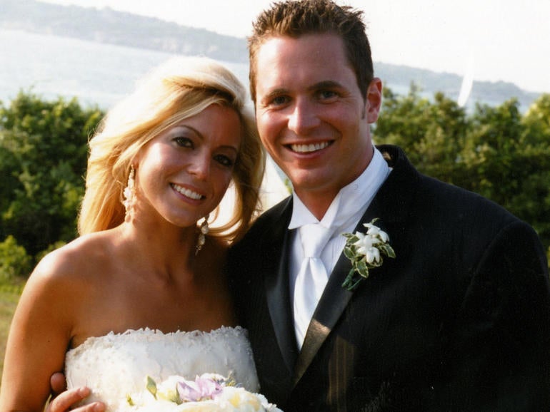 George and Jennifer Hagel smith on their wedding day