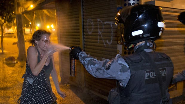 A military police peper sprays a protester during a demonstration in Rio de Janeiro, Brazil, June 17, 2013.