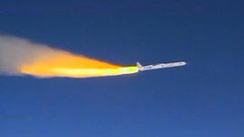 The solid-fuel first-stage motor of the Pegasus XL rocket roars to life above the Pacific Ocean, pushing the Interface Region Imaging Spectrograph, or IRIS, spacecraft toward orbit.