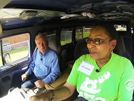 Dean Reynolds rides with Yolanda Morris in the van she uses to safely transport kids to camp in Chicago.