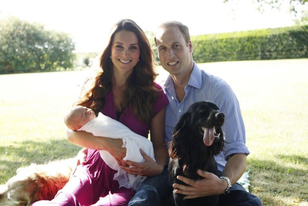 The Duke and Duchess of Cambridge and Prince George are pictured in early August in the Middleton's garden with a retriever called Tilly (a Middleton family pet), and with Lupo, the couple's Cocker Spaniel.