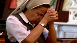 A woman prays at Al Zeytouna Greek Catholic Church in Damascus.