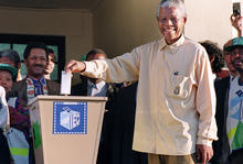 ANC President Nelson Mandela casts his historic vote during South Africa's first democratic and all-race general elections on April 27, 1994.