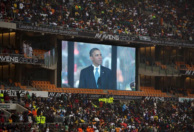 President Obama speaks to mourners attending the memorial service for former South African president Nelson Mandela at the FNB Stadium in Soweto near Johannesburg