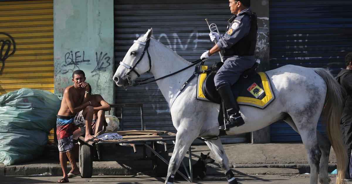 Brazil Police Raid Slums Near Rio De Janeiro Airport Ahead Of World Cup Cbs News
