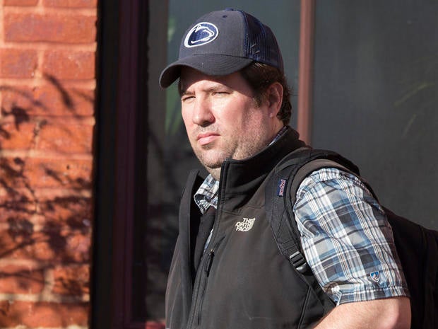 Joe McSpedon, an official of the U.S. Agency for International Development, leaves his house in Washington