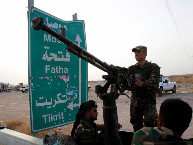 Members of the Kurdish security forces take part in an intensive security deployment on the outskirts of Kirkuk, Iraq, June 12, 2014.