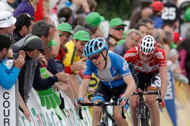 Garmin's Andrew Talansky of USA, winner of the 66th Dauphine cycling race, reacts as he crosses the finish line of the last stage