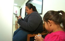 Health clinic workers go door-to-door to sign up uninsured