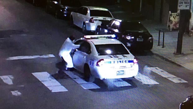 A gunman, identified by police as Edward Archer, takes aim at Philadelphia Officer Jesse Hartnett Jan. 7, 2016, in a still taken from police camera footage.