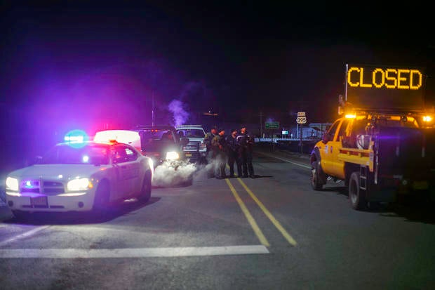 Law enforcement personnel monitor an intersection of closed Highway 395 in Burns, Oregon, Jan. 26, 2016, during a standoff pitting an anti-government militia against U.S. authorities.