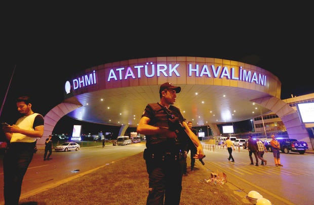 Riot police officer stands guard ealrly on June 289, 2016 at entrance of Ataturk airport in Istanbul, Turkey, following gunfire and multiple suicide bombings the day before