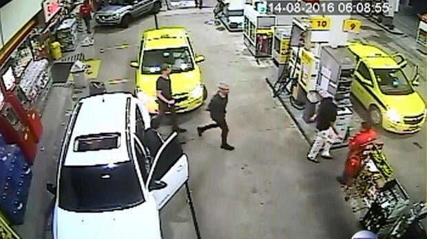 Security video shows three U.S. Olympic swimmers returning to their taxi at a gasoline station where they were accused by staff of having caused damage in Rio de Janeiro, Brazil, Aug. 14, 2016.