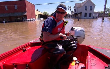 River spills across historic Arkansas town after heavy rains