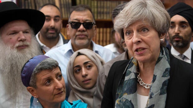 Britain's Prime Minister Theresa May speaks to faith leaders in Finsbury Park Mosque, near the scene of an attack in London, Britain, June 19, 2017.
