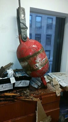 A counterweight from a collapsed crane is seen in an office in New York Feb. 5, 2016.