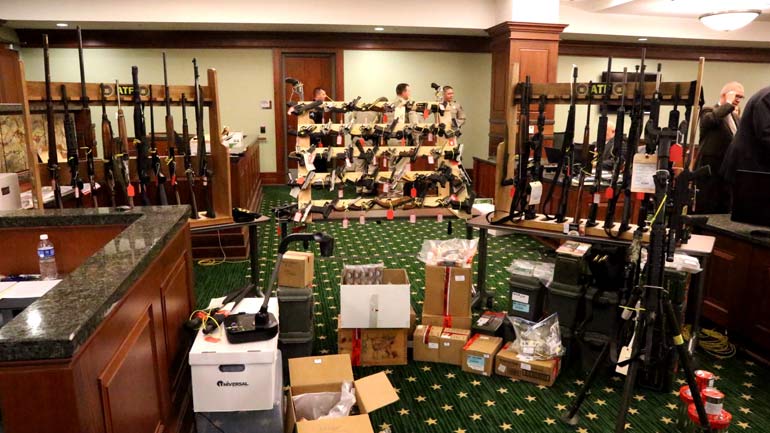 Evidence, inlcluding the weapons stockpile, as shown in court 
