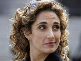Actress Melina Kanakaredes. of the CBS television series "CSI:NY," stops while filming a 2007 episode in Foley Square, in New York. (AP Photo)