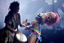 Rihanna, right, performs at the 38th Annual American Music Awards on Sunday, Nov. 21, 2010 in Los Angeles. (AP Photo/Matt Sayles