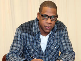 Rapper Jay-Z signs copies of his book 'Decoded' at Barnes & Noble, 5th Avenue on November 17, 2010 in New York City. (Photo by Astrid Stawiarz/Getty Images)