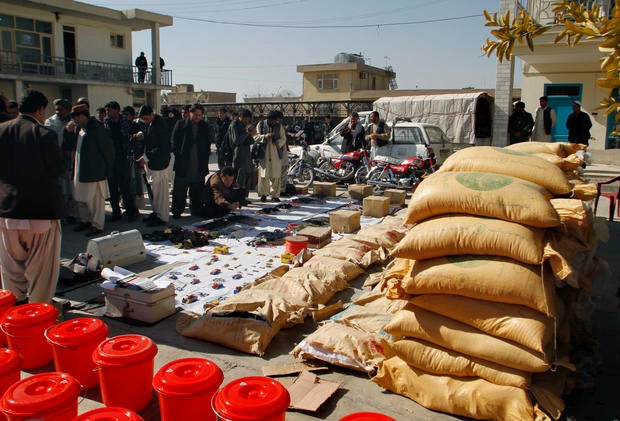 Confiscated Taliban drugs and weapons