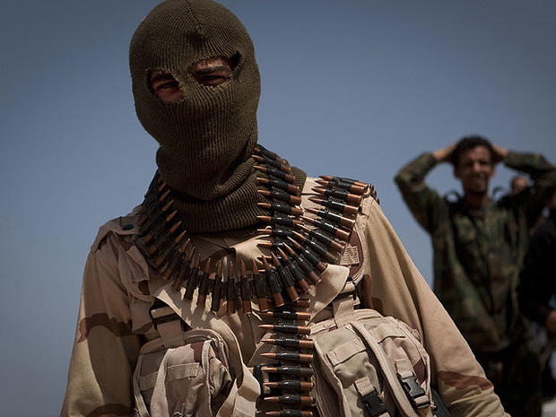A Libyan rebel on the front line outside of Bin Jawaad, 150 km east of Sirte, central Libya, Monday, March 28 2011.