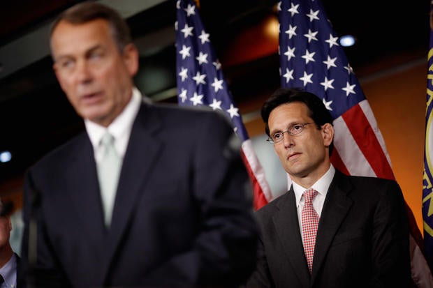 House Majority Leader Eric Cantor (R-VA) listens to Speaker of the House John Boehner (R-OH) during a news conference