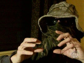 Commander X asked to have his identity concealed before talking with CBS. He says as a member of the Anonymous hacking site, he can shut down web sites with a snap of his fingers.