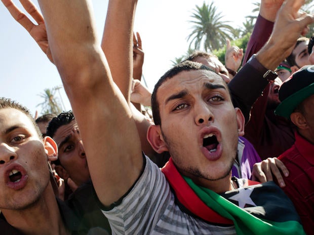 People celebrate at Martyrs' Square, formerly known as Green Square, for the Eid Al-Fitr prayer Aug. 31, 2011, in Tripoli, Libya. Libyans celebrated the first Eid Al-Fitr in 42 years under a new regime.