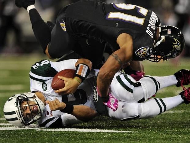 BALTIMORE, MD - OCTOBER 2: Quarterback Mark Sanchez #6 of the New York Jets is hit by linebacker Brendon Ayanbadejo #51 of the Baltimore Ravens during the second quarter at M&T Bank Stadium on October 2, 2011 in Baltimore, Maryland. (Photo by Patrick Smith/Getty Images)