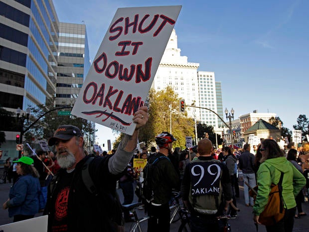 Occupy Oakland protesters close the intersection of 14th and Broadway in downtown Oakland, Calif., Nov. 2, 2011. Oakland's citywide general strike, a hastily planned and ambitious action called by Occupy protesters a day after police forcibly removed their City Hall encampment last week, seeks to shut down the Port of Oakland and other symbols, in their view, of financial greed.