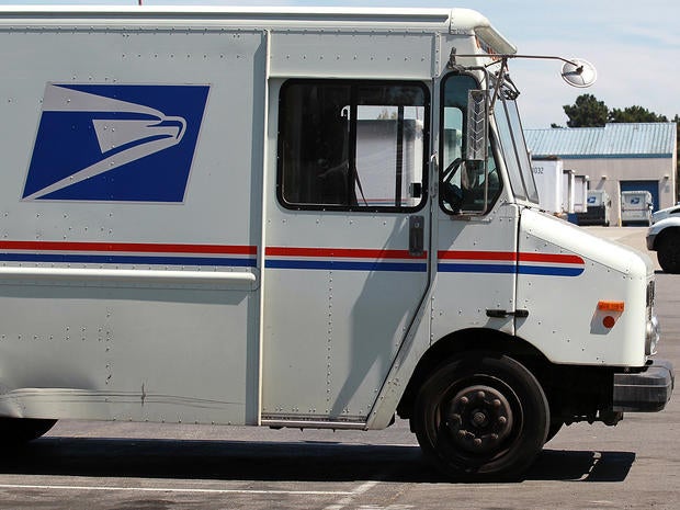 U.S. Postal Service trucks are seen parked near the loading dock at the U.S. Post Office sort center Aug. 12, 2011, in San Francisco.